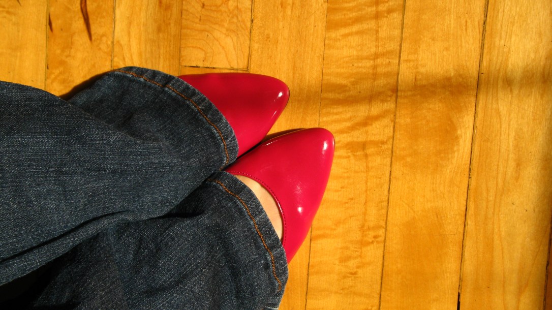 fuschia red pink magenta patent shoes with jeans on a hardwood floor - photograph by oaxacaborn gina munsey