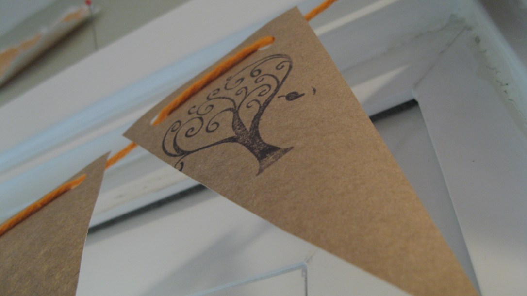 kraft paper pendant/bunting/garland on orange string with tree stamp