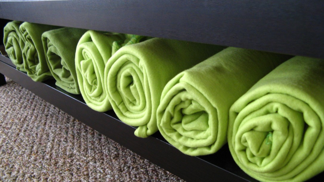 rolled green fleece blankets
