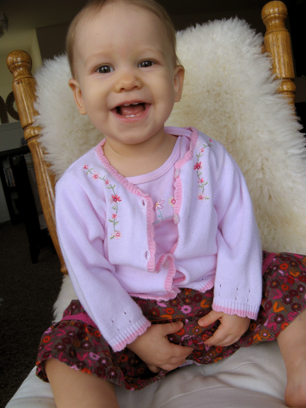 Aveline in sweater set and skirt, on chair