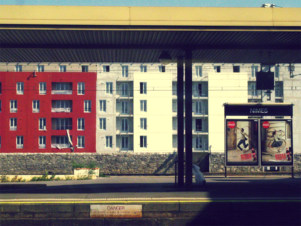 Europe train platform -- colored apartments Europe train platform -- colored apartments