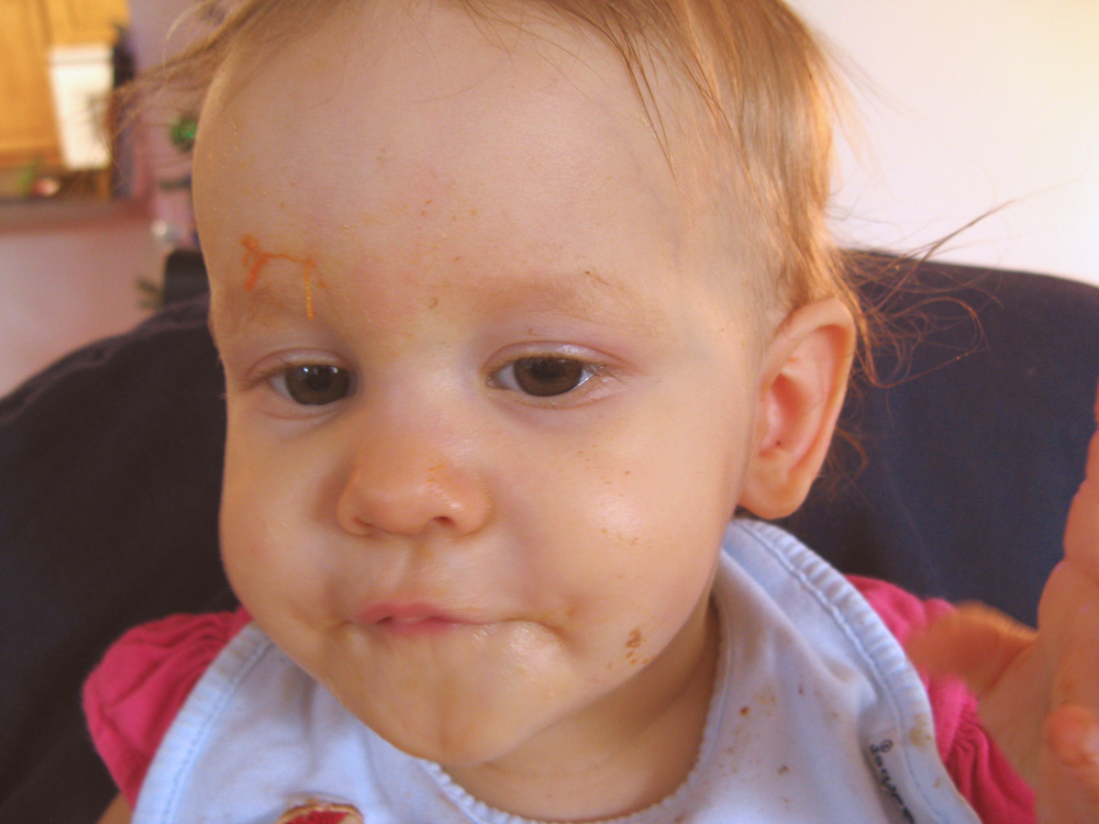 Messy baby eating 