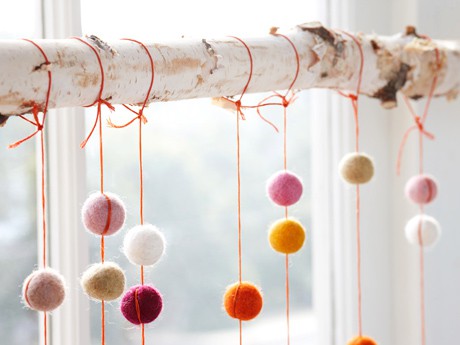 Felt balls on string hung from birch branch - Felt Ball Cascade Kit via the ACME Party Box Company