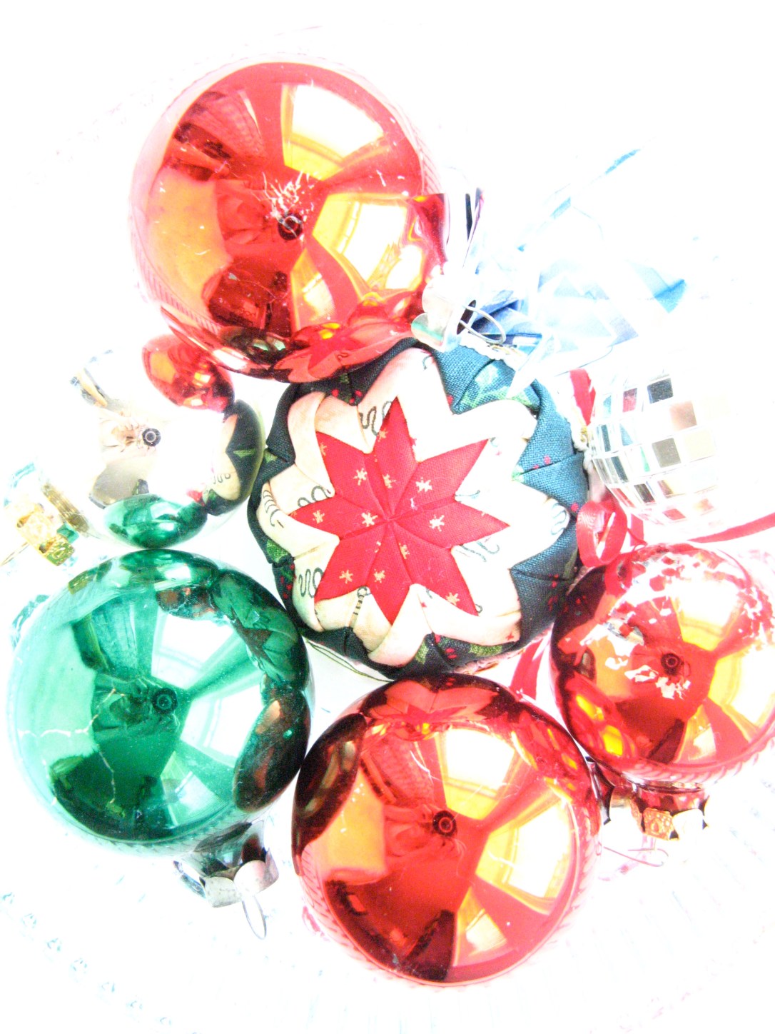 Over exposed photo of christmas ornaments on white background Over exposed photo of christmas ornaments on white background