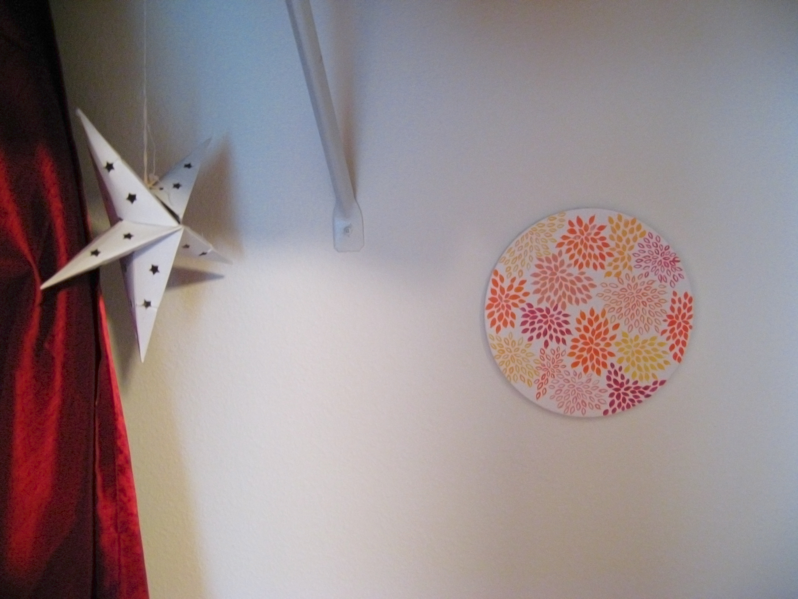 Inside the closet, with a paper star and a painting - photo via Oaxacaborn dot com
