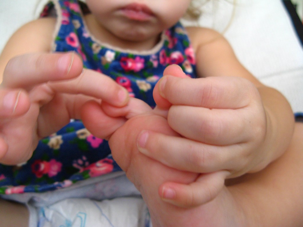 April 2013 - 3 - Aveline holding her toes