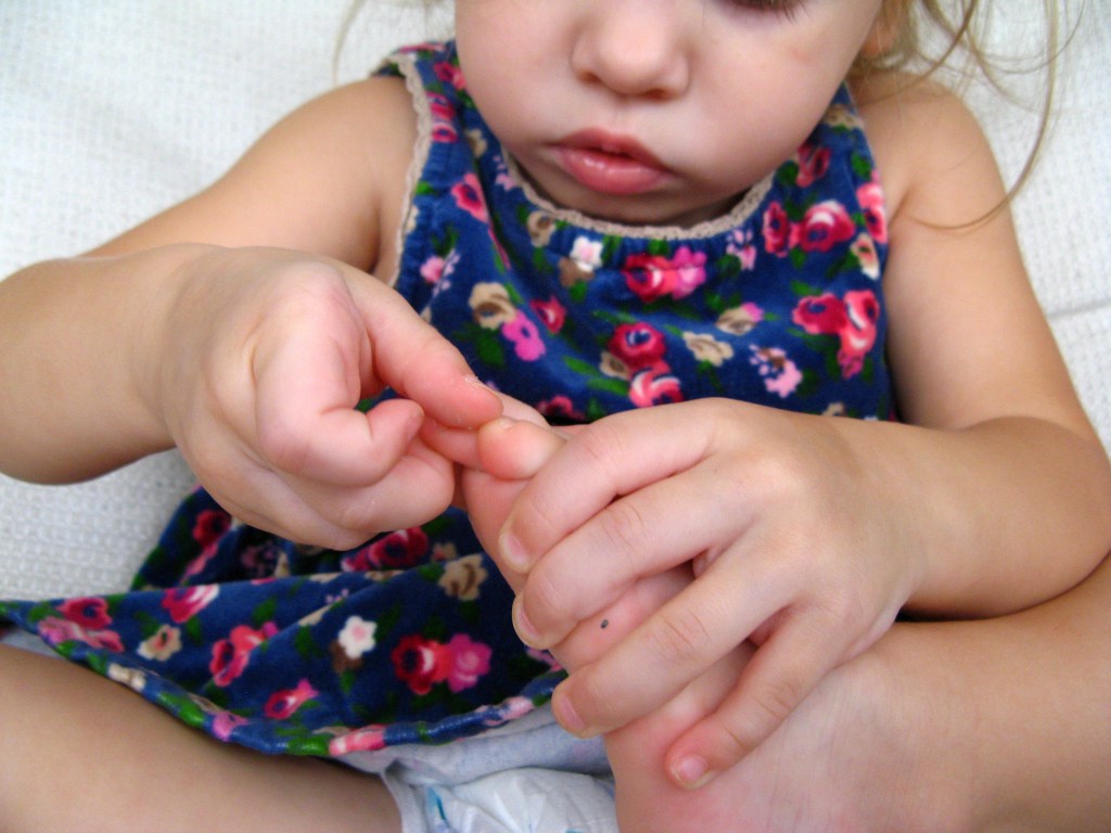 April 2013 - Aveline holding her toes