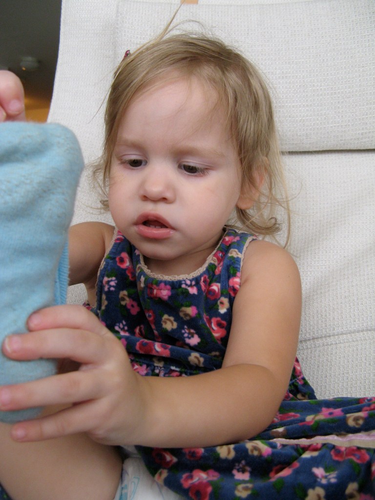 April 2013 - Aveline taking off her sock