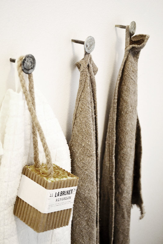 Linen and Burlap Towels Hanging on Nails with Soap from the Portfolio of Johanna Pilfalk