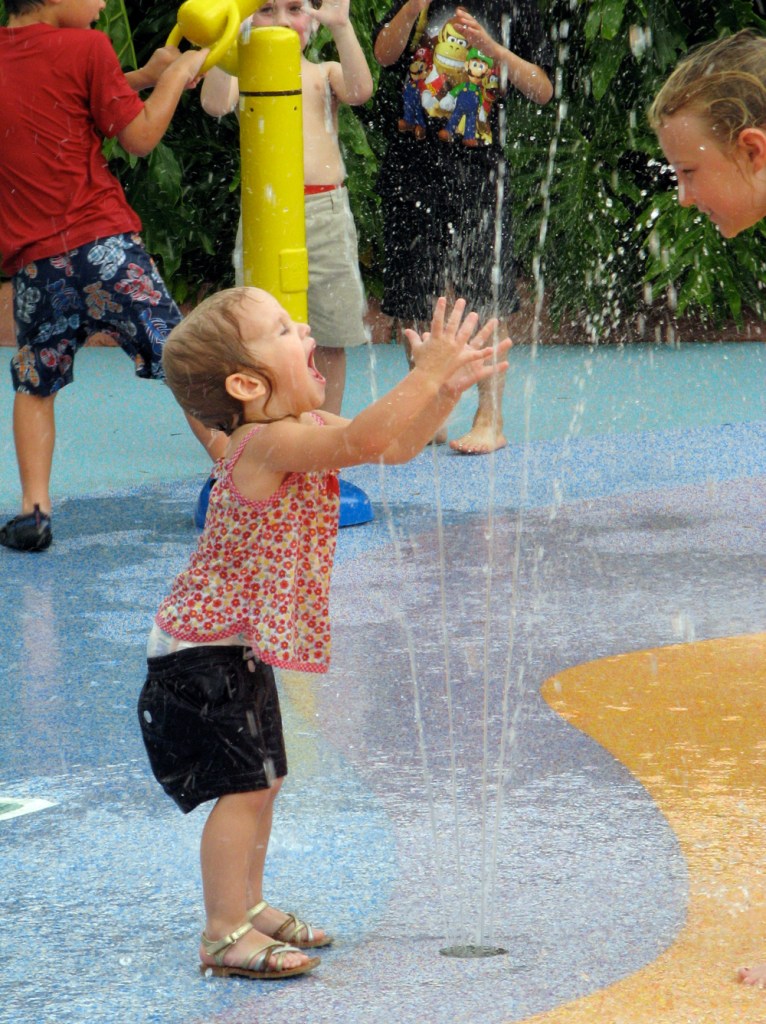 Toddler yelling in joy at water park via Oaxacaborn