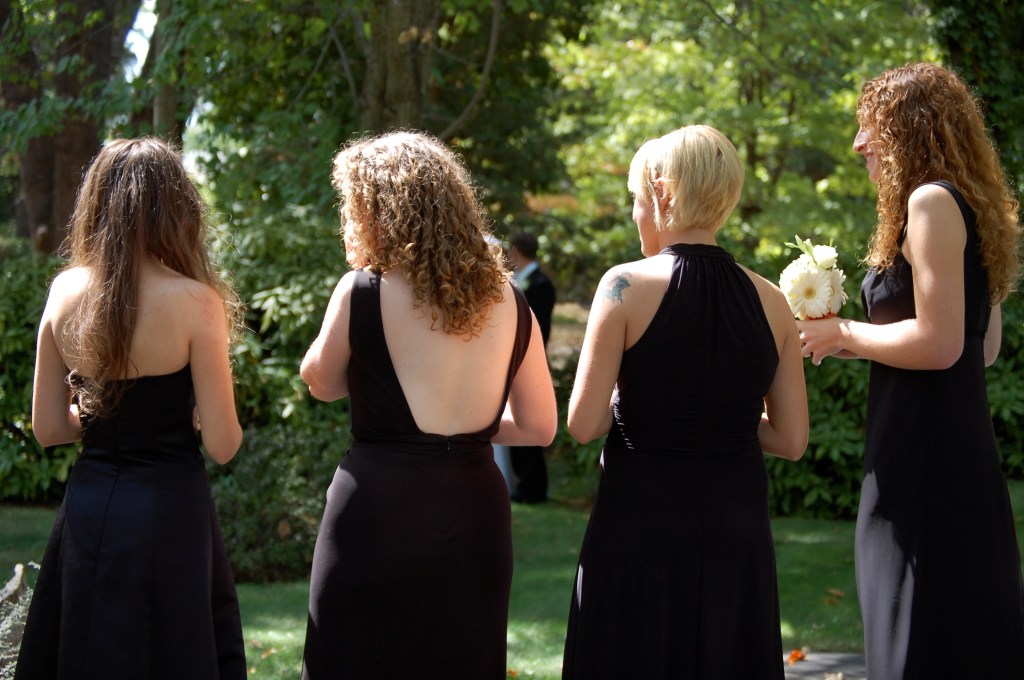 Bridesmaids wearing mismatched black