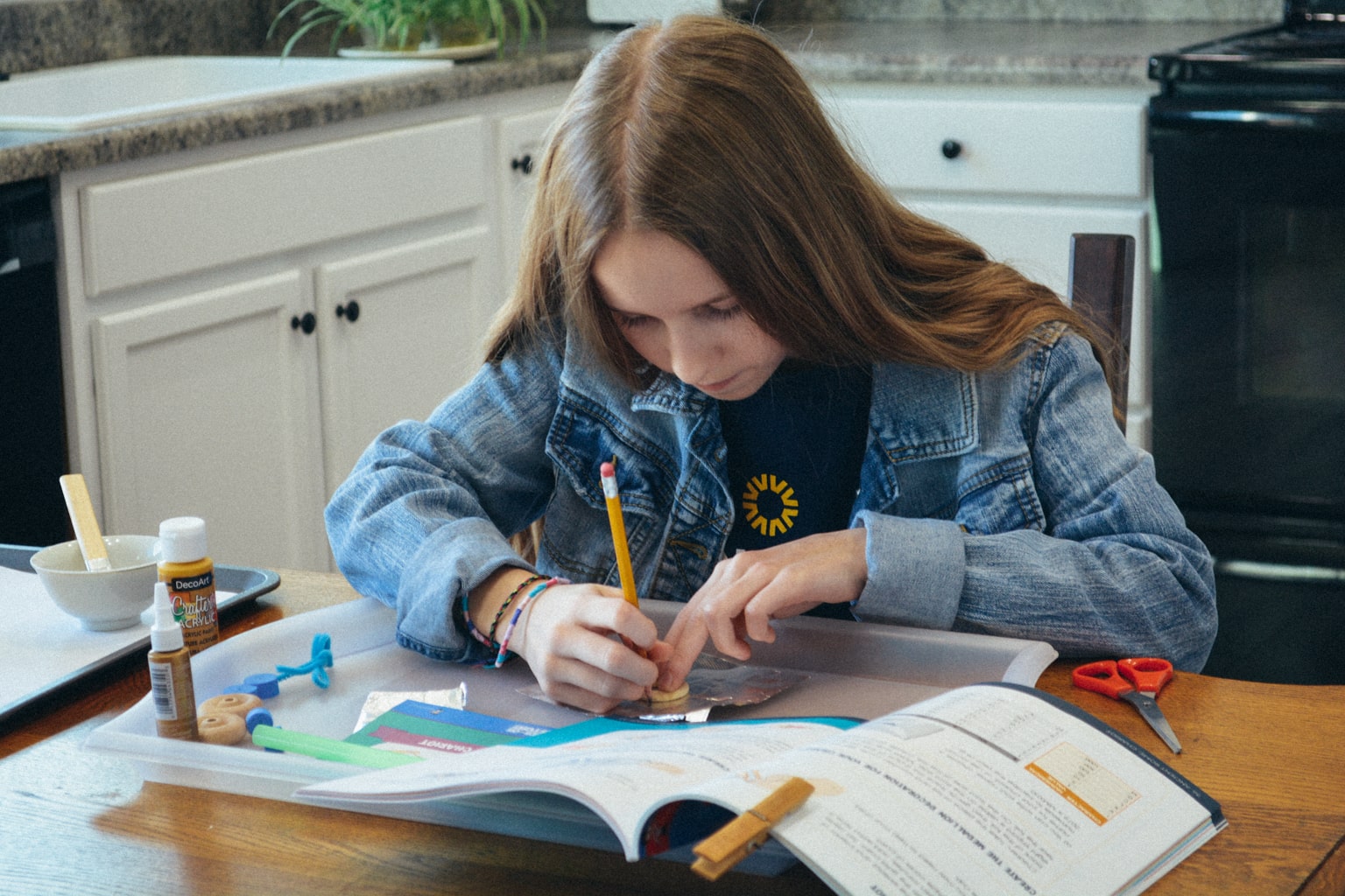 A student works on a history project from Sonlight's Hands-on History box