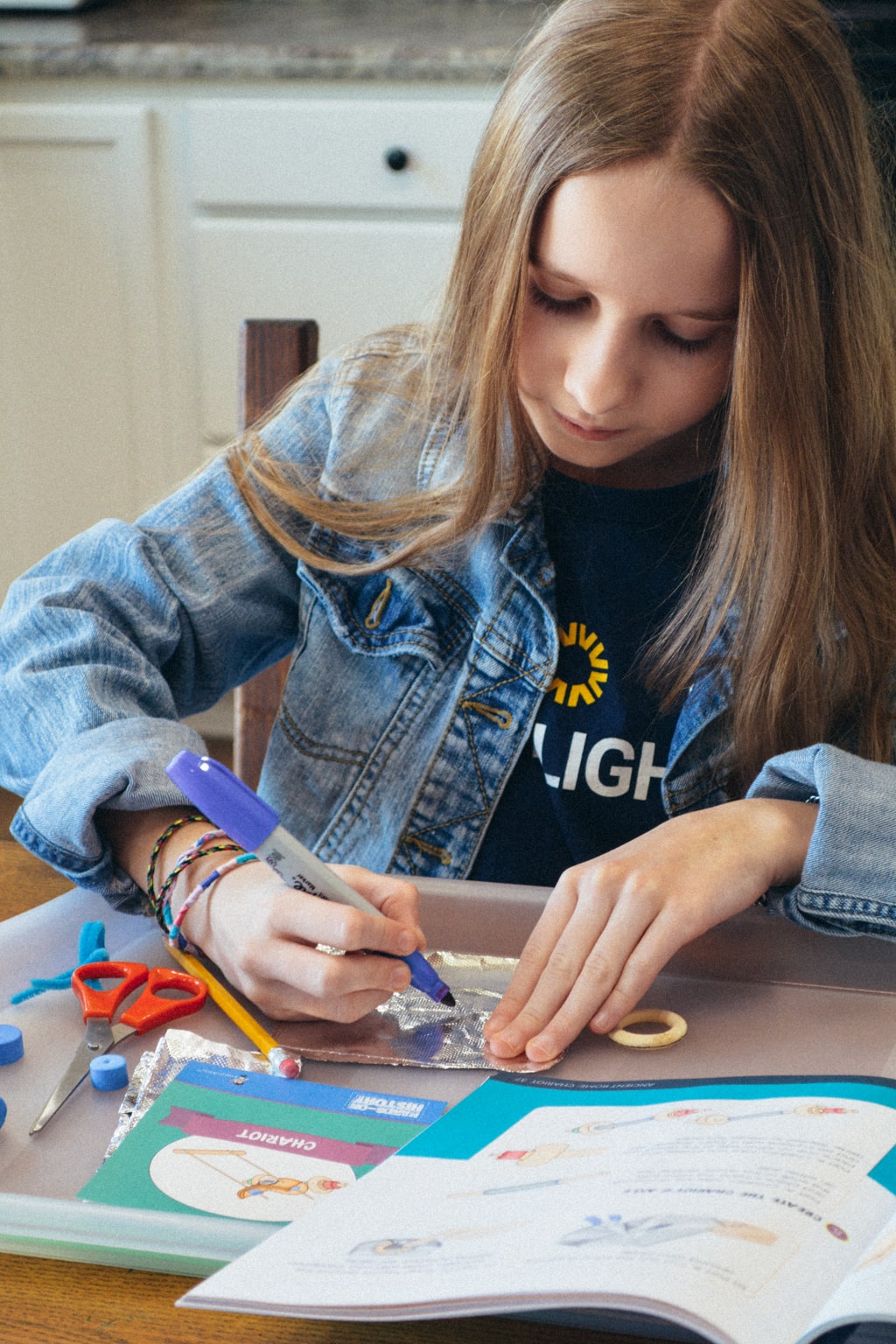 A student works on a history project from Sonlight's Hands-on History box