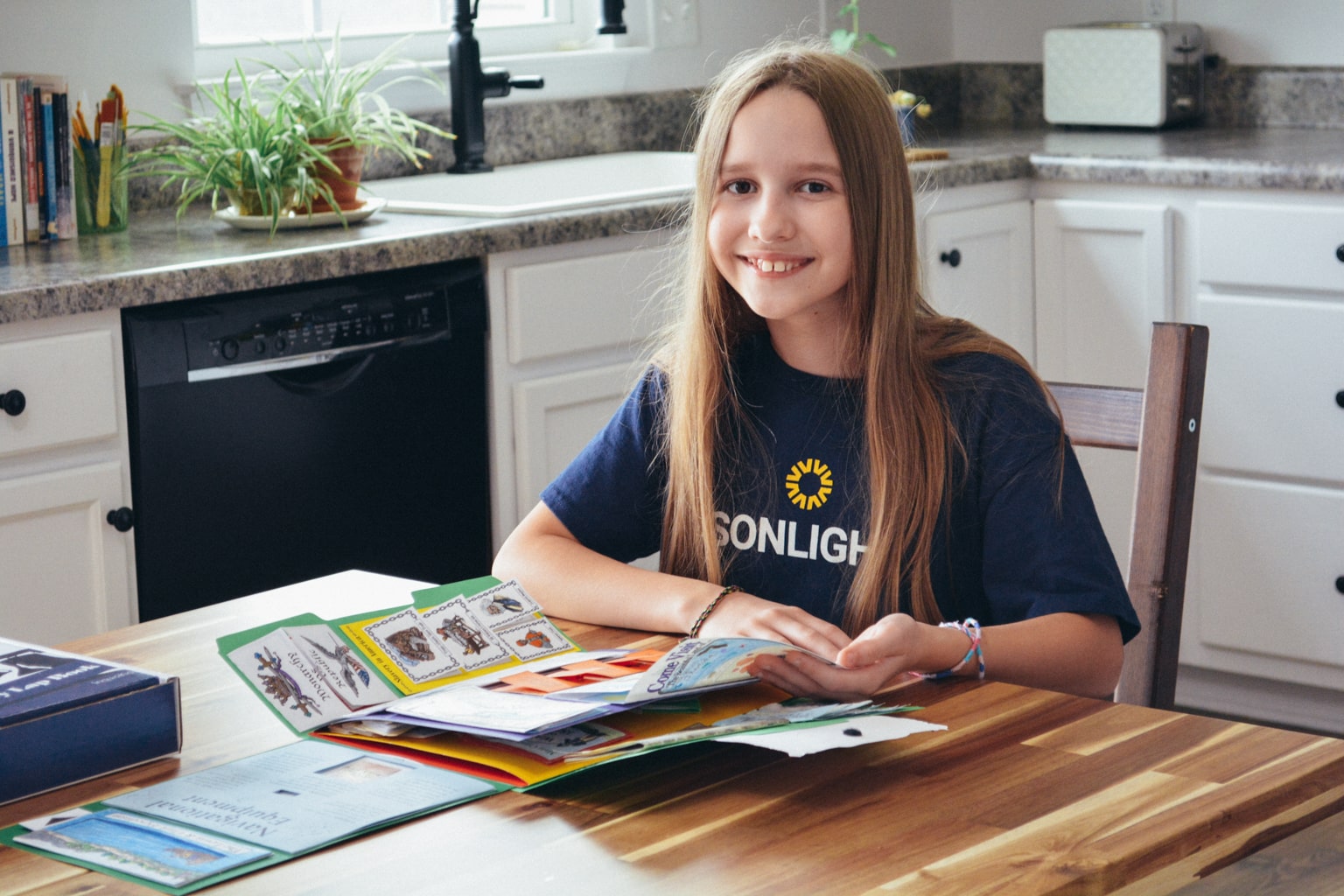 working on a Sonlight history lapbook kit during homeschool history 