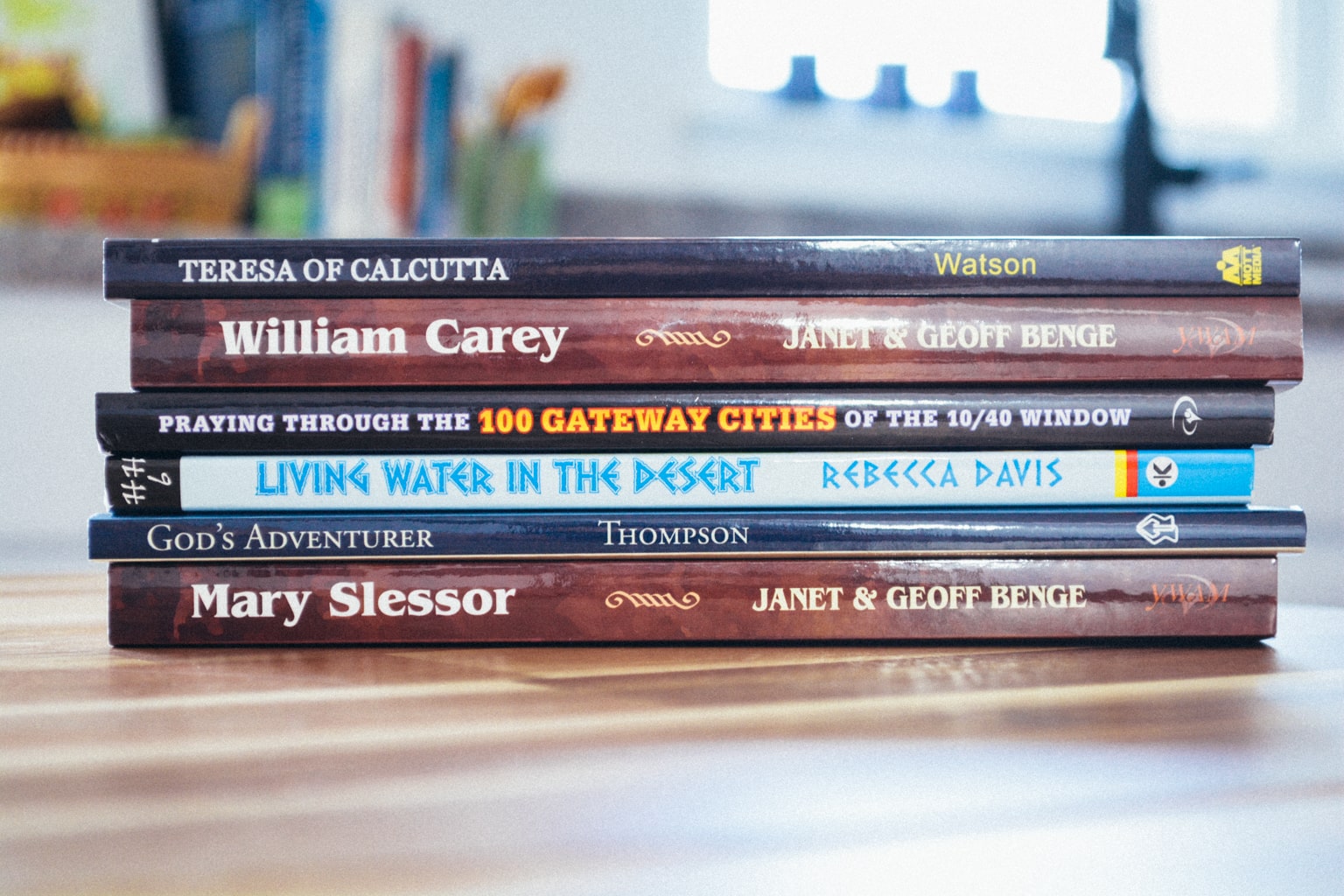 A small stack of missionary biographies from Level F sit on a table.
